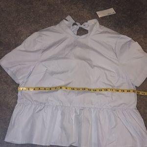 Peplum tie-back top.